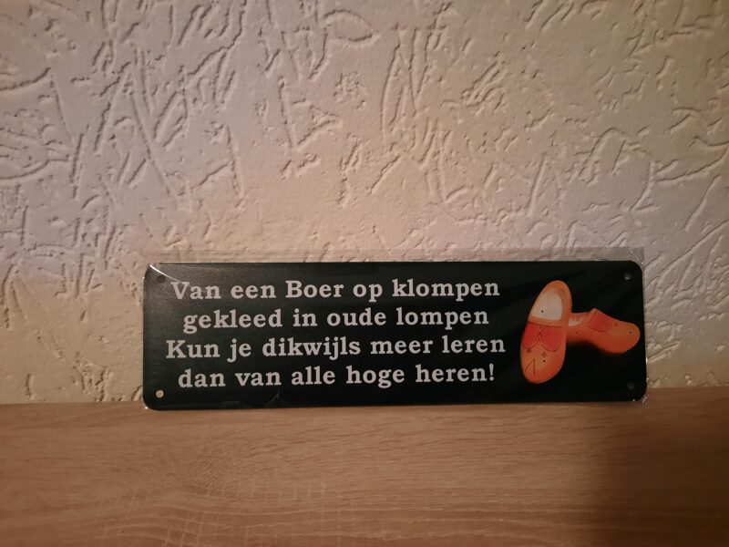 Boer op klompen gezegde